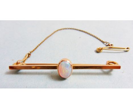 A 15 carat gold bar brooch set opal 