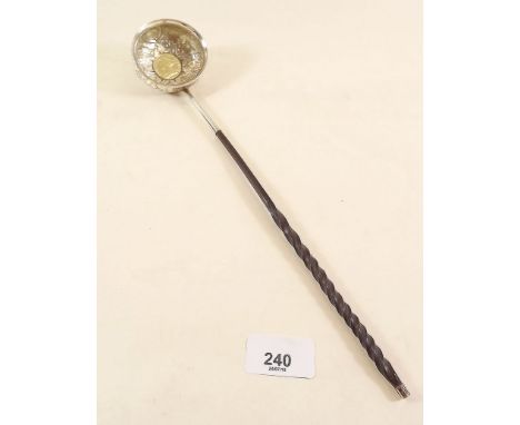 A horn handled silver toddy ladle inset Queen Anne coin 