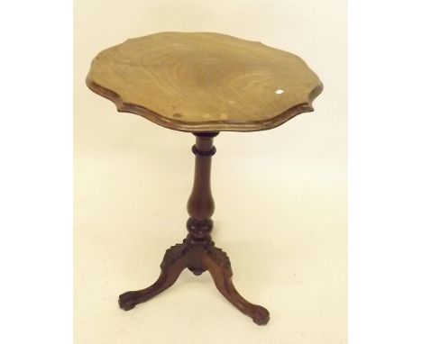 A mahogany frill top occasional table on turned column and carved tripod base 