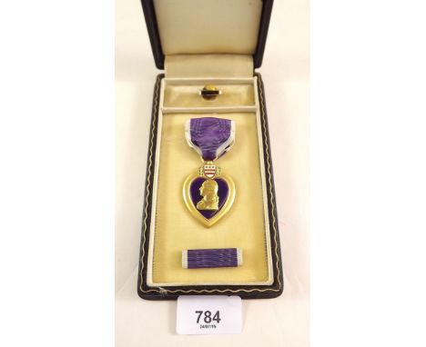 An American purple heart medal boxed with mounted medal ribbon and enamel badge 