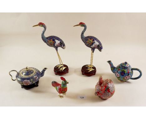 Two enamel teapots, rabbit, two storks and a bird