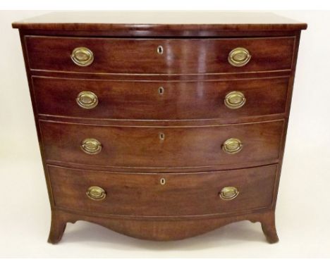 A 19th century mahogany Georgian style bow fronted chest of four drawers on splay feet and shaped apron 