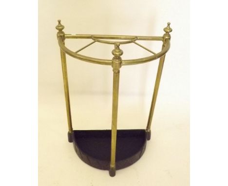 A brass demi-lune stick stand