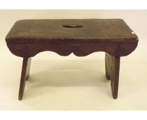 A rustic stool on slab end supports 
