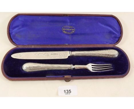 A silver knife and fork with engraving and beaded decoration, cased - Sheffield 1870