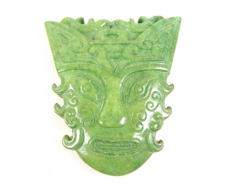 A 'Jade' pendant carved in form of a head