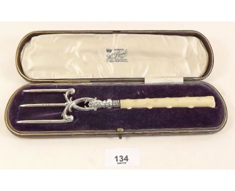 A Victorian silver and ivorine cake serving fork with foliage decoration, cased - Birmingham 1896