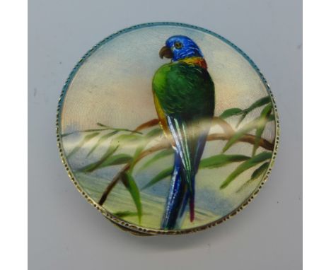 A silver and enamel compact decorated with a parrot, London import mark for 1928, 5cm