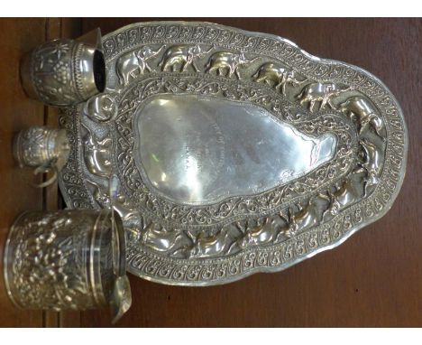 Two white metal jugs, a container, a caddy spoon and a tray marked Sri Lanka