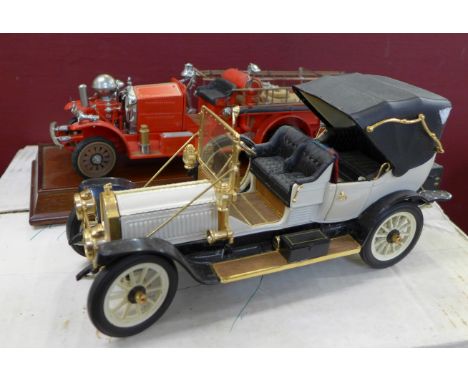 Three Franklin Mint model vehicles, The 1922 Ahrens-Fox R-K-4 Pumper, a 1912 Pakard Victoria and a 1913 Model T Ford, boxed