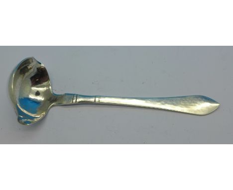 An early 20th Century Georg Jensen silver ladle, circular GI mark, London import mark for 1931