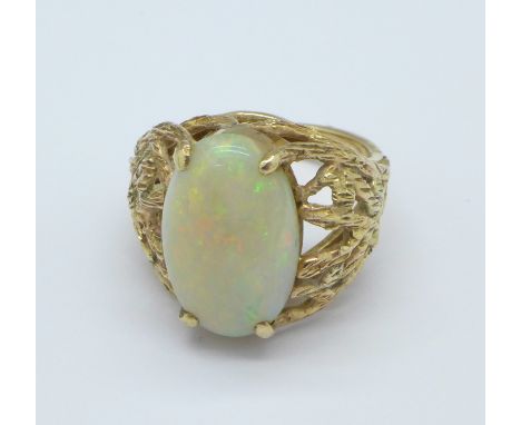 A 14ct gold and opal ring, 8.1g, M, opal 16mm x 10mm