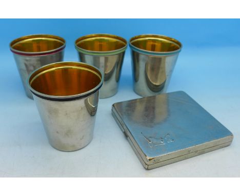 A set of four gilded hunting cups and a compact marked Valentine