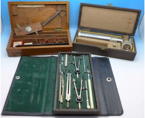 A cased drawing set, an Ultra Lens magnifying glass and a small box with tools for a student marked Agricultural College Wye