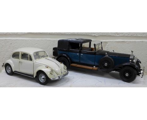 Three Franklin Mint model vehicles, a 1967 Volkswagen Beetle, a 1911 Rolls Royce Tourer and a 1929 Rolls Royce Phantom, boxed