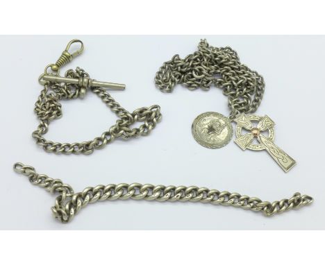 A silver Albert chain with metal T-bar and clip, an Irish silver Celtic cross on a metal chain and  a small silver chain