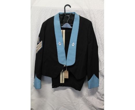 British Army uniform, a black&nbsp;jacket with Standard Buildings Gatoff label having Northumberland Hussars lapel badges, bu