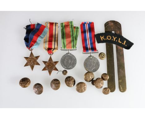 WWII medal group comprising war medal, Defence medal, 1939-1945 star, Africa star, also a KOYLI cloth shoulder title, brass b