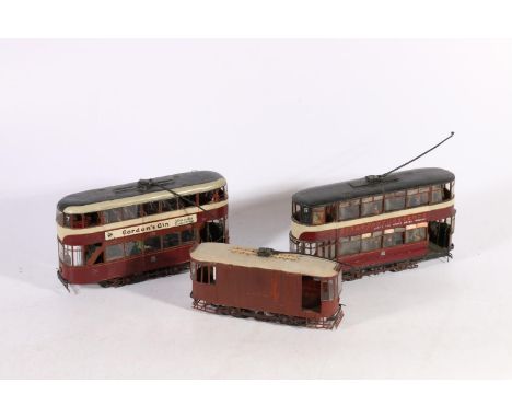 Three OO gauge scale electrically operated tram cars, two are signed "WM LITTLE TRANSPORT MANAGER"?, 20cm long and another 17