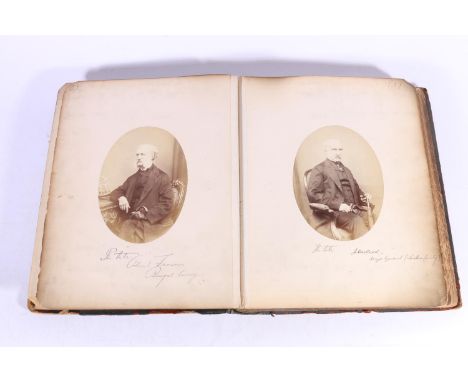 Large format album with Caledonian United Service Club library label, containing around 72 photographic portraits of gentleme