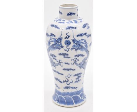 Chinese 19thC&nbsp;blue and white vase decorated with dragons chasing a flaming pearl and four character Kangxi mark to base,