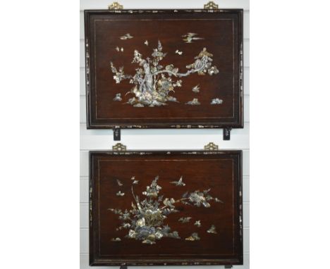 A pair of rosewood mother of pearl and abalone inlaid wall panels decorated with birds and foliage, 56 x 42cm