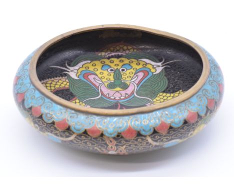 Chinese cloisonné enamel dish depicting a dragon chasing a flaming pearl, diameter 14cm