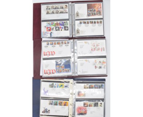 A collection of GB first day covers in ten folders, three coin covers still in packaging, arrowfile refill pages and a Locomo