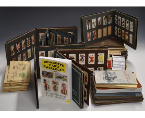 A collection of twelve cigarette card albums, mainly 1920s and 1930s, sets and part sets including John Players Poultry, Dogs