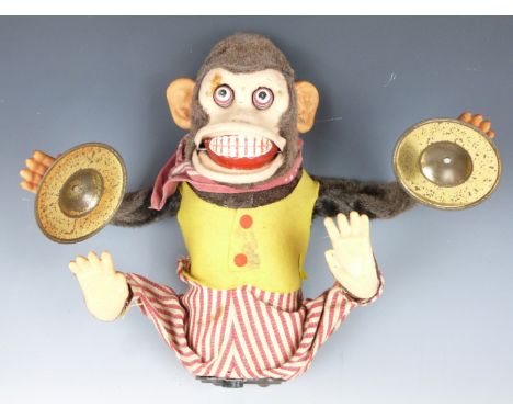 Japanese battery operated tinplate and felt model monkey playing the cymbals, 28cm tall.&nbsp;