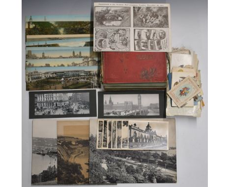 Over 350 postcards some contained in two Edwardian and later postcard albums and the rest as loose cards including three gian