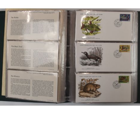 The official collection of 105 World Wildlife first day covers, in a green album&nbsp;