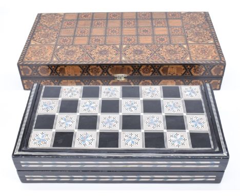 Eastern inlaid backgammon set together with another similar mother of pearl and abalone inlaid board, largest 50 x 25cm when 