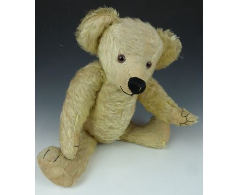 Steiff style Teddy bear with blonde mohair, stitched snout and pads, glass eyes and jointed limbs, 49cm tall.&nbsp;