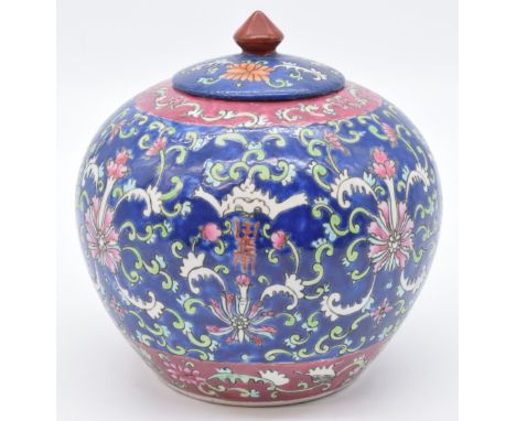 Chinese ginger jar with pink, blue and green enamel decoration and four character mark to base, 21cm tall