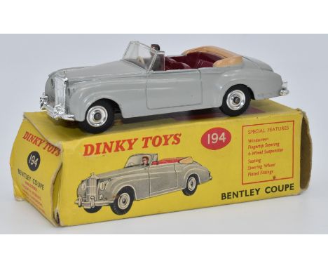 Dinky Toys diecast model Bentley Coupe with grey body, maroon interior, driver and suspension, 194, in original box.&nbsp;