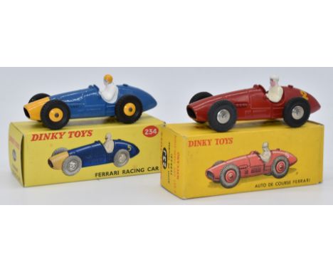 Two Dinky Toys diecast model vehicles Auto De Course Ferrari with red body, white driver and racing number '2' 23J, and Ferra