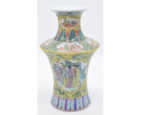 Chinese famille jaune vase of waisted form decorated to one side with ladies playing 'go', the other with ladies admiring flo