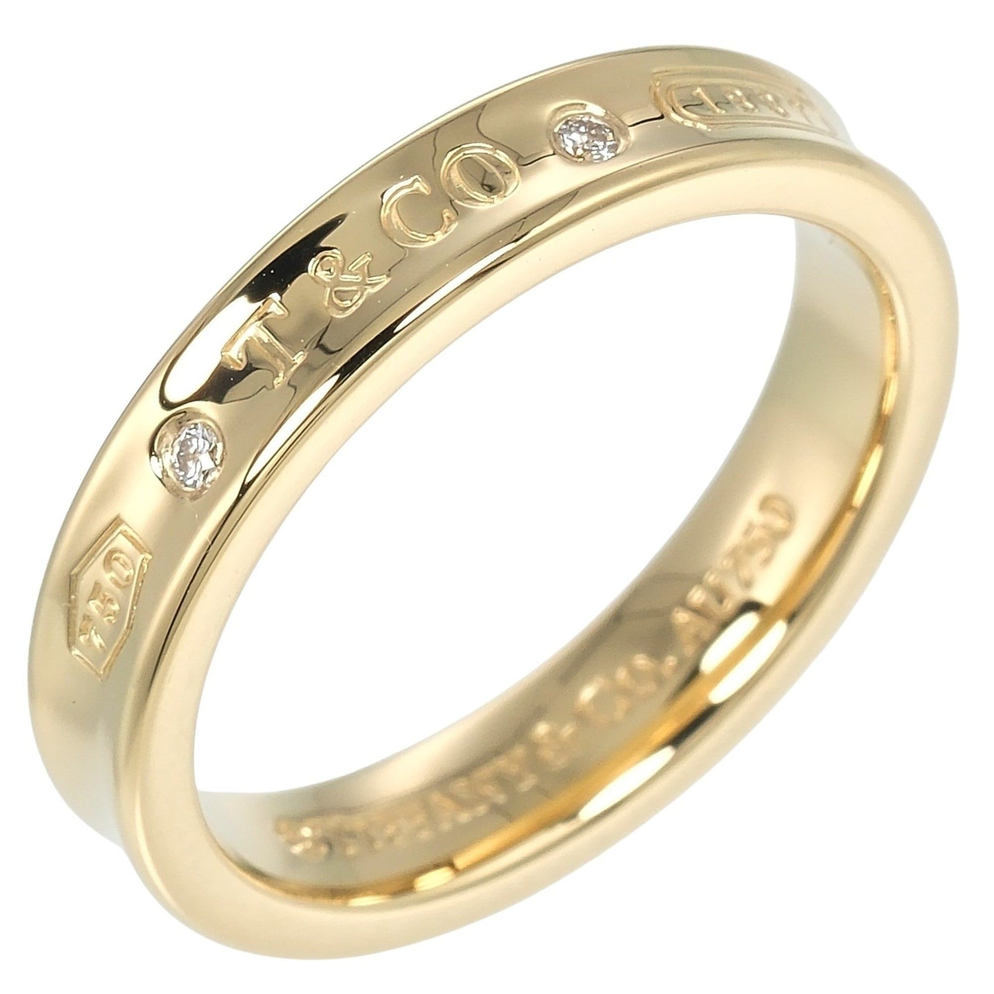 Tiffany & Co. 1837 ring, size 15, 18K Yellow Gold with two diamonds, approximately 6.6g.