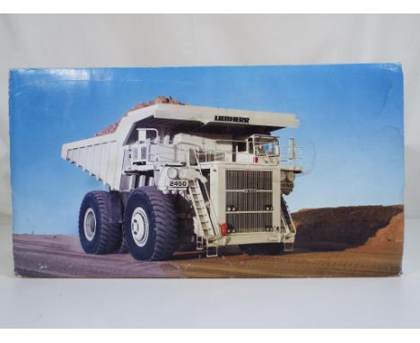 Diecast - a Conrad Mining Truck KL 2450 in original box in 1:50 scale, model appear to be in near mint condition with some ma