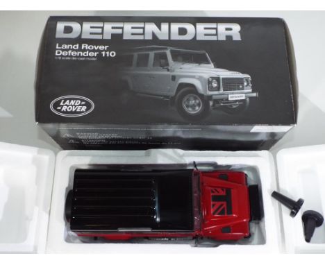 Diecast - a Land Rover Defender 110 in 1:18 scale By Dorlop in original box, model appears to be in mint condition but loose 