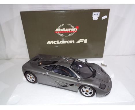 McLaren Collection F1 - a 1:12 scale diecast model depicting a McLaren F1 car issued in a limited edition of less than 200, a