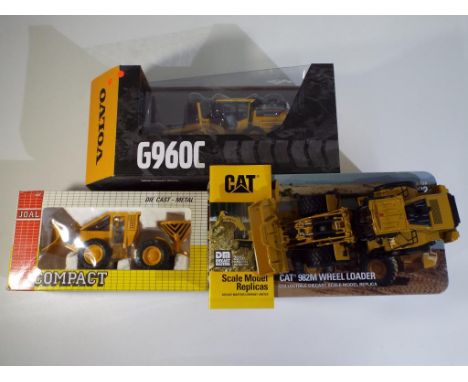 Diecast - three excavators in original boxes, comprising Diecast Masters CAT 982M Wheel Loader, Motorart Volvo Grader 960C an