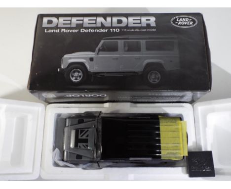 Diecast - a Land Rover Defender 110 in original box in 1:18 scale by Dorlop, model appears to be in mint condition, in excell