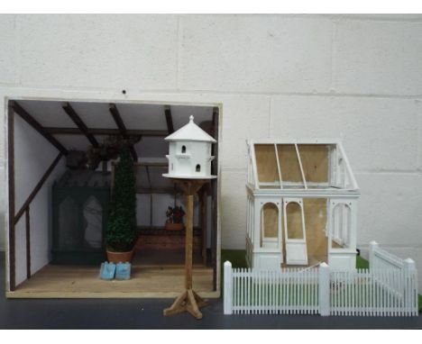 Dolls Houses - a wooden house featuring avery and greenhouse requires some work to finish, approximate height 38 cm x 40 cm [