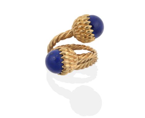 A Lapis Lazuli Torque Ring, designed by Schlumberger, for Tiffany, two lapis lazuli beads in textured cup settings, to a bypa