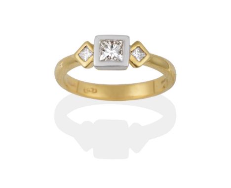 An 18 Carat Gold Diamond Three Stone Ring, the central princess cut diamond in a white rubbed over setting, between two small