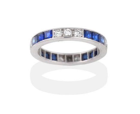 A Sapphire and Diamond Eternity Ring, trios of round brilliant cut diamonds and square calibré cut sapphires alternate, total