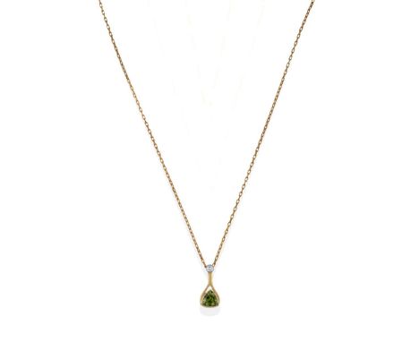 An 18 Carat Gold Diamond and Tourmaline Pendant on Chain, the drop pendant comprising a round brilliant cut diamond in a whit