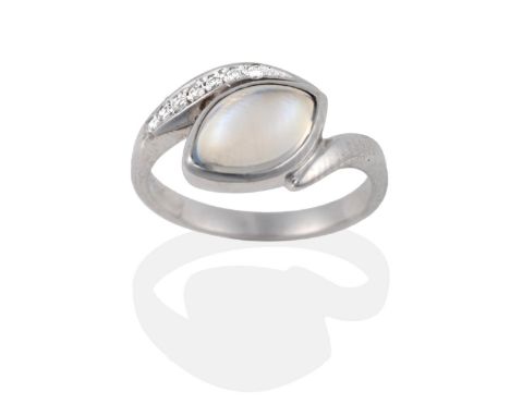 An 18 Carat White Gold Moonstone and Diamond Ring, the marquise shaped cabochon moonstone within twist shoulders, one shoulde